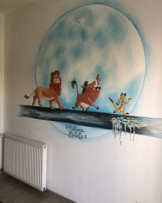 the lion king mural is painted on the wall