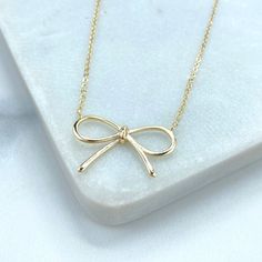 18k Gold Filled Ribbon Bow Necklace, 16 Inches with Extender, 1mm Curb Link Chain and Cute Bow Charm Necklace, Wholesale Jewelry. - Necklace Size: Length: 16 Inches +2 Inches |  Thickness: 1mm - Pendant Size: Length: 15mm  | Width: 24mm |  Thickness: 1mm 💎 Discover DiJu Jewelry: Your Destination for Quality and Style With new products added daily, DiJu Jewelry offers a wide selection of unique, modern designs at competitive prices. We prioritize elegance and keep pace with the latest market trends. - Elevate Your Jewelry Business - Start Your Own Venture - Create Your Own Collection 📲 Explore a myriad of styles in our DiJu Jewelry Etsy Store: DiJu Jewelry Etsy Store 💎 Our collection features a diverse range of distinctive styles, including earrings, necklaces, pendants, charms, bracelet Necklace Coquette, Bow Charm, Bow Necklace, Cute Bow, Necklace Size, Ribbon Bow, Jewelry Business, Chain Choker, Cute Bows