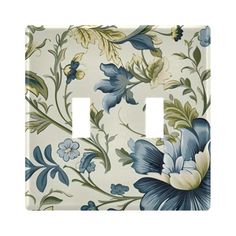 a light switch cover with blue and white flowers