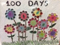 a sign with flowers painted on it that says 100 days and has words written in the middle