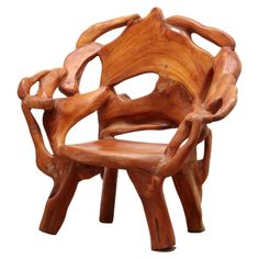 a wooden chair made out of wood with arms and legs