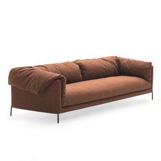 a brown couch sitting on top of a white floor