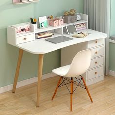 a white desk topped with a laptop computer next to a chair and shelf filled with books