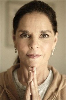 a woman with her hands folded in prayer