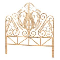 a white headboard with an intricate design