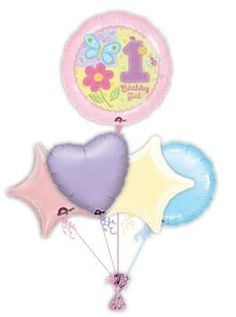 the 1st birthday balloon bouquet is filled with balloons and heliums, including one for each child's first birthday