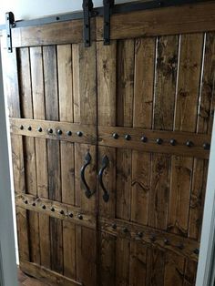 two wooden doors with metal handles and knobs