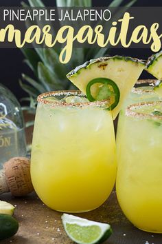 pineapple jalapeno margaritas are garnished with lime and pepper