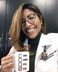 a woman wearing glasses and holding a coffee mug in her right hand, with the caption mr ms dr written on it