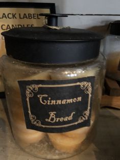 a jar filled with cinnamon bread sitting on top of a counter