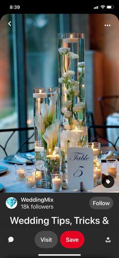 the table is set with candles and flowers