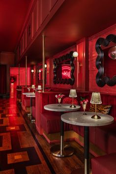 the interior of a restaurant with red walls