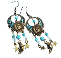 "Add funky Celestial style to your outfits by slipping on these whimsical earrings featuring a bunch of dangling sun & moon charms and hand-accented filigree pendants!  Little stars and a half moon swing beneath turquoise blue magnesite beads and faceted glass beads for fun movement! And they're super comfy to wear because they are lightweight...so no annoying pulling on your ears as they sway! A cute addition to your jewelry box or a great gift idea! Antiqued Gold-plated Earwires, Antiqued Gold Whimsical Earrings, Celestial Style, Boho Sun, Sun Moon And Stars, Earrings Handmade Dangle, Turquoise Accents, Ocean Vibes, Filigree Pendant, Bleu Turquoise