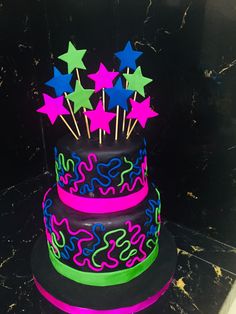 a brightly colored cake with stars on top