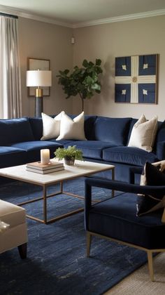 a living room filled with blue couches and white pillows on top of a rug