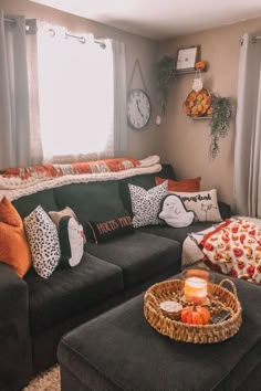 a living room filled with furniture and pillows