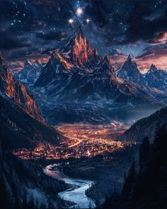 the night sky is lit up over a mountain town