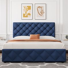 a bed with blue upholstered headboard in a white and beige bedroom setting