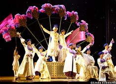 a group of people standing on top of a stage