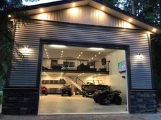 an open garage door with lights on the side and stairs leading up to the second floor