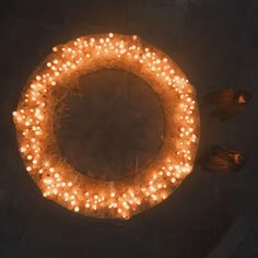 there are many lit candles in the shape of a circle on top of a table