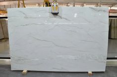 a large white marble slab in a warehouse