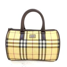 This Timeless Burberry Handbag Showcases The Iconic Burberry Check Pattern, Crafted From Durable Canvas And Accented With Dark Leather Handles And Trim. The Barrel Shape Adds A Touch Of Sophistication, Making It A Versatile Accessory For Any Occasion. The Bag Features A Top Zipper Closure, An Interior Zip Pocket For Added Organization, And Is Lined With Luxurious Beige Silk Featuring The Burberry Logo. Measurements: Width: 10 Inches Height: 6 Inches Depth: 5 Inches Handle Drop: 4 Inches Conditio Burberry Handbags Classic, Burberry Crossbody Bag, Burberry Handbag, Burberry Logo, Burberry Classic, Beige Silk, Burberry Handbags, Burberry Women, Check Pattern