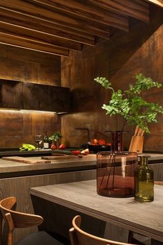 a table with a vase on top of it next to some chairs and a cutting board