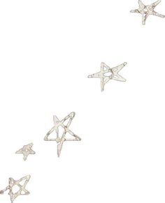 five silver stars are flying in the air together, with one star falling off it's side