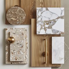 marble and wood pieces are arranged on the wall, including one with a golden handle