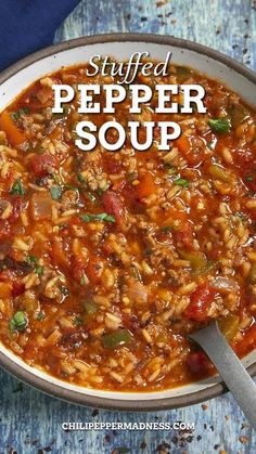 a bowl of stuffed pepper soup with a spoon in it on a blue tablecloth