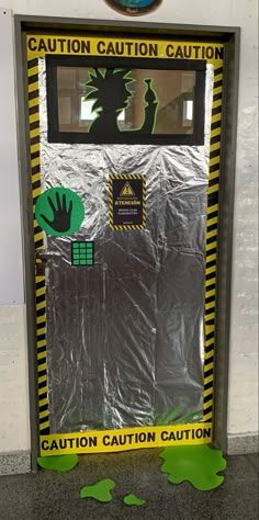 an image of a caution sign in front of a door that is taped to the wall