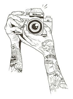 a hand holding up a camera with tattoos on it