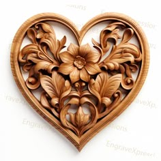 an intricate wooden heart with flowers and leaves carved into the center, on a white background