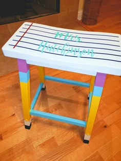 a table with writing on it that says hello thriftshop in blue and yellow