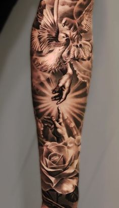 a man with a tattoo on his arm that has angels and roses on it,