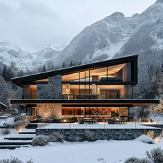 a modern house in the mountains covered with snow