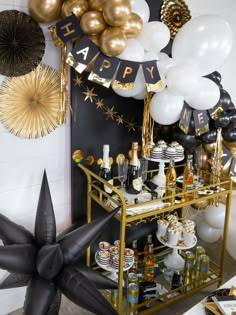 a black and gold birthday party with balloons