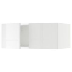 an open white cabinet with doors and drawers