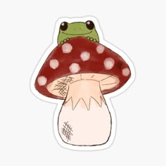 a green frog sitting on top of a mushroom with polka dot dots around it's head