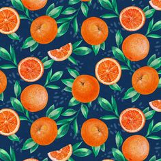 an orange pattern on a blue background with green leaves and slices of the same fruit