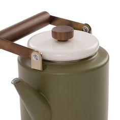 a green tea pot with a wooden handle