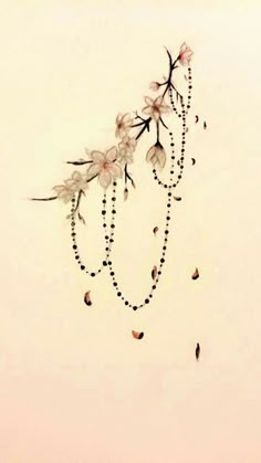 a drawing of flowers and beads on a white background