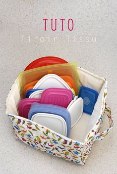 a basket filled with lots of different colored dishes