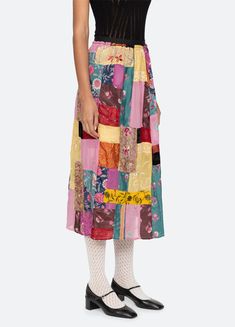 Hand crafted from vintage saris, the Phoebe patchwork skirt features an elasticized waist, and multi colored patchwork design throughout. Each garment is individually made with vintage saris, making each piece unique. No two are exactly alike. Details: 60% polyester, 40% viscose invisible side zipper style #AW24-131 model is 5'10'' and wearing a size S PRE-ORDER: EXPECTED DELIVERY 8/30-9/30 Phoebe Skirt, Sea Ny, Patchwork Skirt, Vintage Saris, Patchwork Designs, Poplin Shirt, Kids Sleepwear, Fall Shirts, Thom Browne