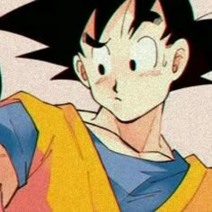 an animated image of a young gohan with black hair and yellow shirt holding a green object