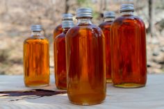 several bottles are lined up on a table