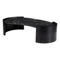 an oval black marble table with curved legs