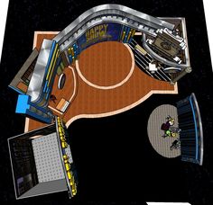 an overhead view of a skateboard park in the middle of a black area with blue walls