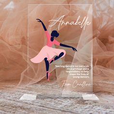 an acrylic plaque with a ballerina on it's front and bottom